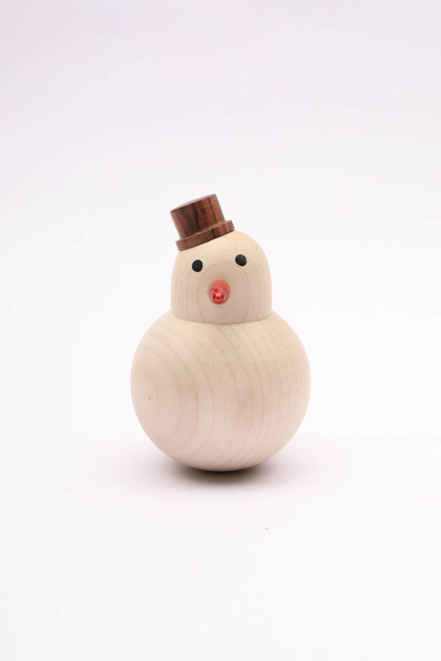 An image of the Wooden Roly Poly Snowman for babies by Bumshum, a nature-friendly store for kids. This charming snowman toy is made from natural wood, designed for sensory engagement, and brings the magic of eco-friendly play to your baby's world