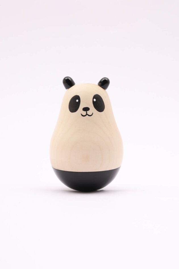 An image of the Wooden Roly Poly Panda for babies by Bumshum, a nature-friendly store for kids. This charming panda-shaped toy is made from natural wood and designed for sensory engagement, adding a touch of eco-friendly playfulness to your baby's playtime